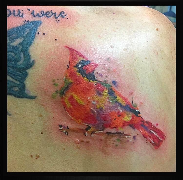 Painting-like tattoo of a bird